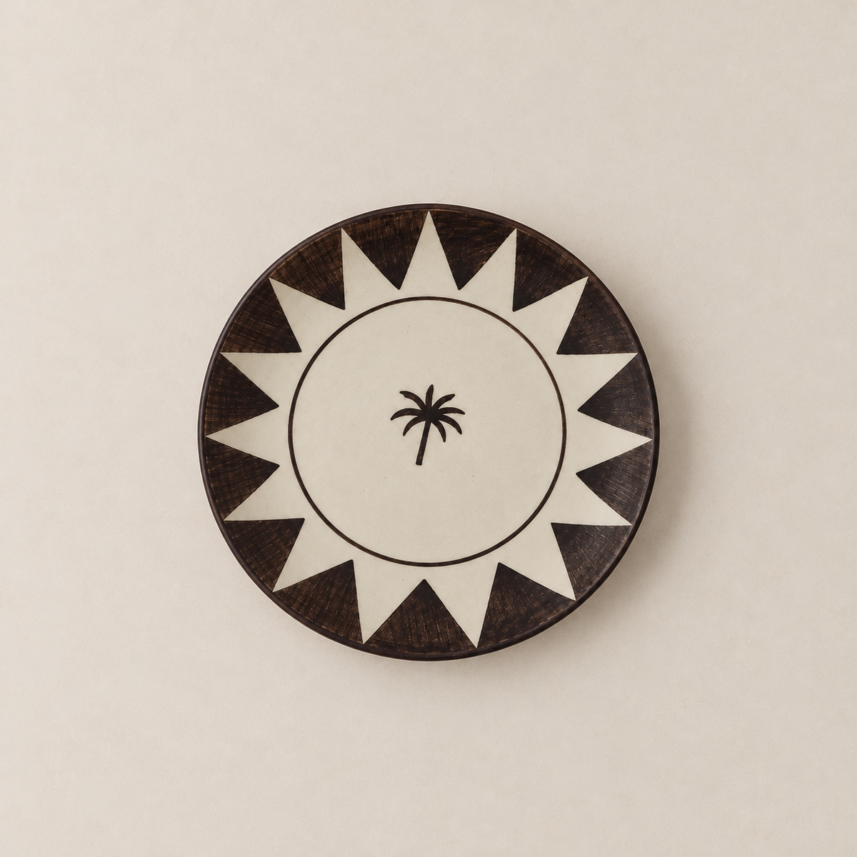 Ivory ceramic breakfast plate with brown sunburst border and palm tree
