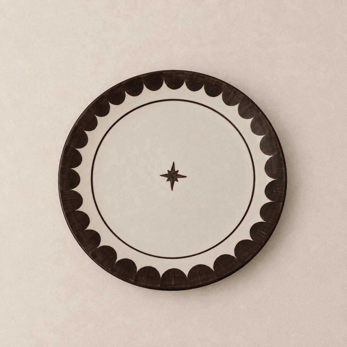 Ivory ceramic dinner plate with cocoa brown scalloped border and small star