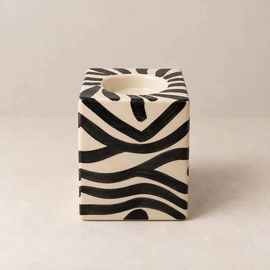 Small square ceramic tealight holder with black and cream zebra stripes